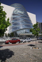 Ireland, County Dublin, Dublin City, the Convention Centre building, view of the facade with tree in foreground.