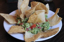 Mexico, Bajio, San Miguel de Allende, Plate of guacamole and tacos.