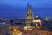 Mexico, Jalisco, Guadalajara, View of Cathedral and city at night.