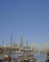 England, London, Tower Bridge on the River Thames with the Shard skyscraper behind.