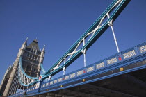 England, London, Tower Bridge viewed from river bank.