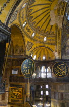 Turkey, Istanbul, Sultanahmet, Haghia Sophia Christian murals and Muslim iconography in calligraphic roundels together in the domed interior.