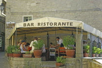 Republic of San Marino, San Marino City, tourists sat in restaurant.