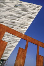 Ireland, Belfast, Titanic Quarter, Titanic Belfast Visitor Experience, Graphic shapes of a section of the building and the Titanic sign.