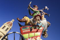 Spain, Valencia Province, Valencia, Las Fallas scene with Papier Mache figures on a Bus Turistic in Plaza Ayuntamiento during Las Fallas festival.