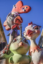 Spain, Valencia Province, Valencia, Papier Mache figures in the street during Las Fallas festival.