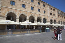 Spain, Catalonia, Barcelona, Tourists walking along promenade next to Museu D'Historia De Catalunya.