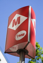 Spain, Catalonia, Barcelona, Red Metro sign against a blue sky.