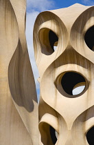 Spain, catalonia, Barcelona, Chimneys and vents on the roof of Casa Mila apartment building known as La Pedrera or Stone Quarry designed by Antoni Gaudi in the Eixample district.