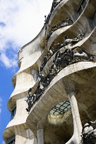 Spain, catalonia, Barcelona, Facade of Casa Mila apartment building known as La Pedrera or Stone Quarry designed by Antoni Gaudi in the Eixample district.