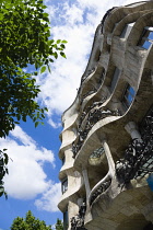 Spain, Catalonia, Barcelona, Facade of Casa Mila apartment building known as La Pedrera or Stone Quarry designed by Antoni Gaudi in the Eixample district.