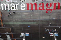 Spain, Catalonia, Barcelona, Mare Magnum mirrored glass modern shopping mall.