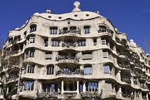 Spain, Catalunya, Barcelona, La Pedrera by Antoni Gaudi, a section of the building's facade.