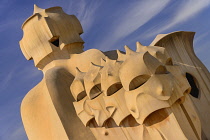 Spain, Catalunya, Barcelona, Antoni Gaudi's La Pedrera building, a section of chimney pots on the roof terrace.