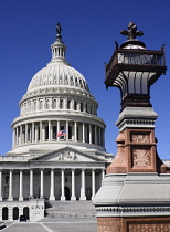 USA, Washington DC, Capitol Building, Head on view of the central section with its dome and lampstand in the foreground.