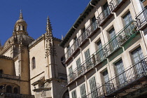 Spain, Castille-Leon, Segovia, Apartments in the Plaza Mayor with the Cathedral in the background.