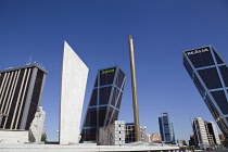 Spain, Madrid, Puerta de Europa with the monument to Calvo Sotelo in the foreground at Plaza de Castilla.