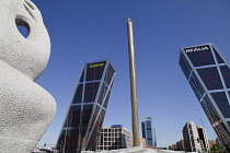 Spain, Madrid, Puerta de Europa with the monument to Calvo Sotelo in the foreground at Plaza de Castilla.