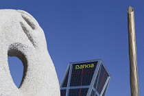 Spain, Madrid, Puerta de Europa with the monument to Calvo Sotelo in the foreground at Plaza de Castilla.