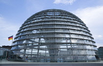 Germany, Berlin, Mitte, Tiergarten, exterior of the glass dome on the top of the Reichstag building designed by architect Norman Foster with a double-helix spiral ramp around the mirrored cone that re...