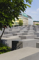 Germany, Berlin, Mitte, Holocaust Memorial designed by US architect Peter Eisenmann with a field of grey slabs symbolizing the millions of Jews killed by the Nazis.