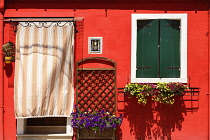 Italy, Veneto, Burano Island, Colourful row of house facades.