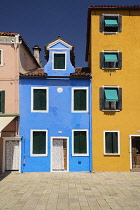 Italy, Veneto, Burano Island, Piazza Baldassarre Galuppi, Colourful houses in the square.