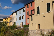 Italy, Tuscany, Lucca, Barga, Colourful facades to houses in the old town.