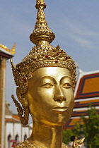 Thailand, Bangkok, Grand Palace, Head and face of gold female statue.