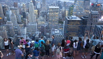 USA, New York State, New York City, Manhattan, Crowds of tourists viewing the skyline seen from top of the Rockefeller Center.