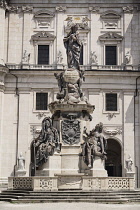 Austria, Salzburg, Salzburg Dom or Cathedral withThe Maria Immaculata Column in the foreground.