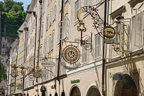 Austria, Salzburg, Getreidegasse street with some of its wrought iron shop signs.