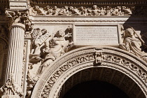 Spain, Andalucia, Granada, Sculptures and carvings above and around one of the doors to the Cathedral.