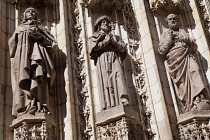 Spain, Andalucia, Seville, Carved figures on the Cathedral Door of the Assumption.