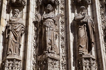 Spain, Andalucia, Seville, Carved figures on the Cathedral Door of the Assumption.