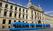 Croatia, Zagreb, Old town, Mihanoviceva Street, Hz Vuca Vlakova national railway headquarters with tram apssing by.