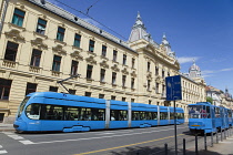 Croatia, Zagreb, Old town, Mihanoviceva Street, Hz Vuca Vlakova national railway headquarters with tram apssing by.