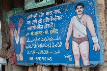 India, Delhi, Sign for a road-side medical practitioner in the old quarter of Delhi.