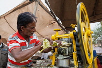 India, Rajasthan, Pushkar, Sugar cane vendor.