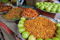 India, Bengal, Kolkata, Food stall at Malik Ghat Flower Market selling chickpeas, prawns and fish.