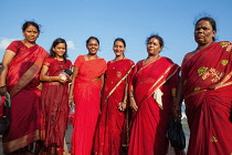 India, Tamil Nadu, Mahabalipuram, A group of pilgrims on the beach at Mahabalipuram.