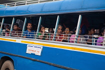 India, Kerala, Thiruvananthapuram, Passengers on a public bus in Thiruvananthapuram.