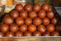 India, Karnataka, Bijapur, Display of Gulab Jamun, Indian sweets, in the market at Bijapur.