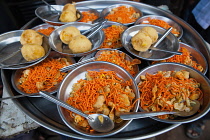 India, Maharashtra, Dhule, Plates of kachori & chat.