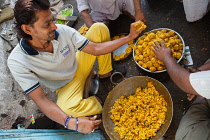 India, Maharashtra, Dhule, Making sabudana vada at a street food stall in Dhule.