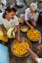 India, Maharashtra, Dhule, Making sabudana vada at a street food stall in Dhule.