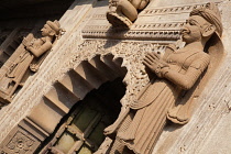 India, Madhya Pradesh, Maheshwar, Statues on either side of a doorway at the Ahilya Fort in Maheshwar.