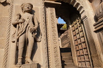 India, Madhya Pradesh, Maheshwar, Statues on the side of a doorway at the Ahilya Fort in Maheshwar.