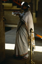 Sri lanka, General, Woman in temple with offerings.