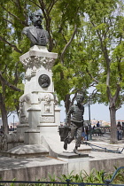 Portugal, Estremadura, Lisbon, Bairro Alto, Statue in Sao Pedro de Alcantara gardens.